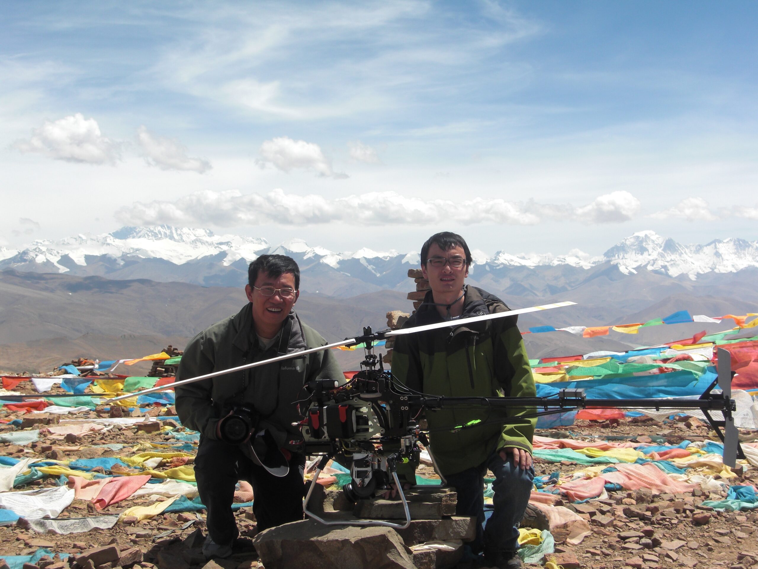 Inspirational photo: A future founder of DJI, Frank Wang with HKUST professor Zexiang Li in 2009 during the first unmanned flight to the top of the mount Everest.